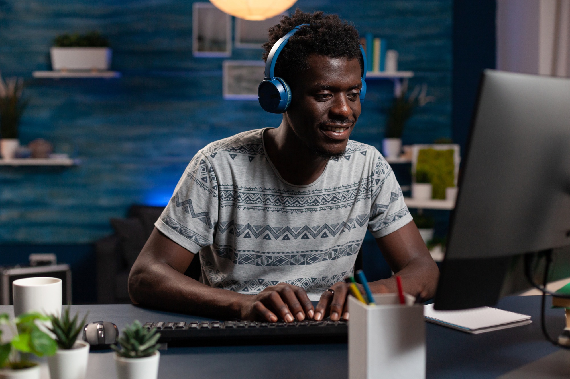 Man student wearing headphone while attending at online webinar